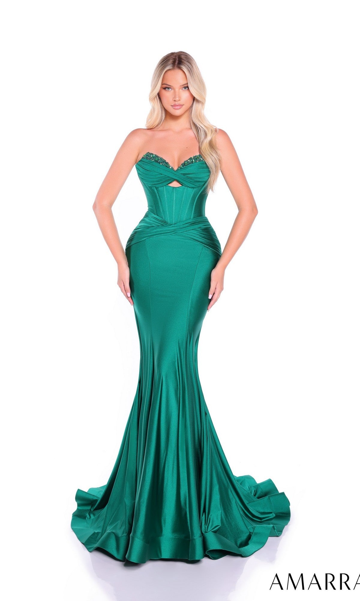 A woman wearing the Amarra 89062 long prom dress, a strapless mermaid style with an embellished sweetheart neckline and subtle ruching, stands against a white background.